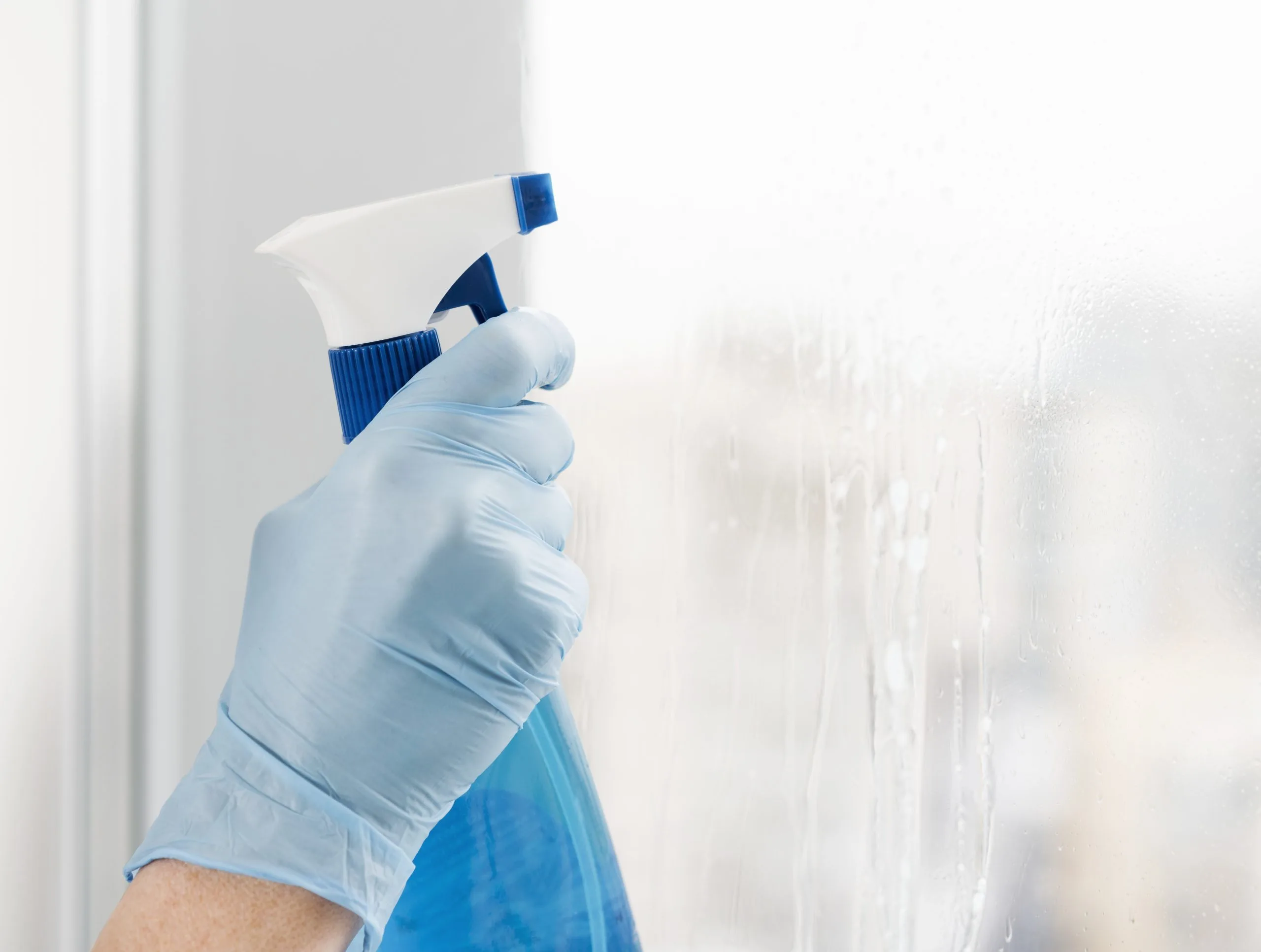 woman-cleaning-window-scaled.jpg